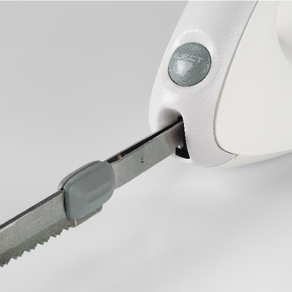 A close-up of an electric knife with a gray handle.