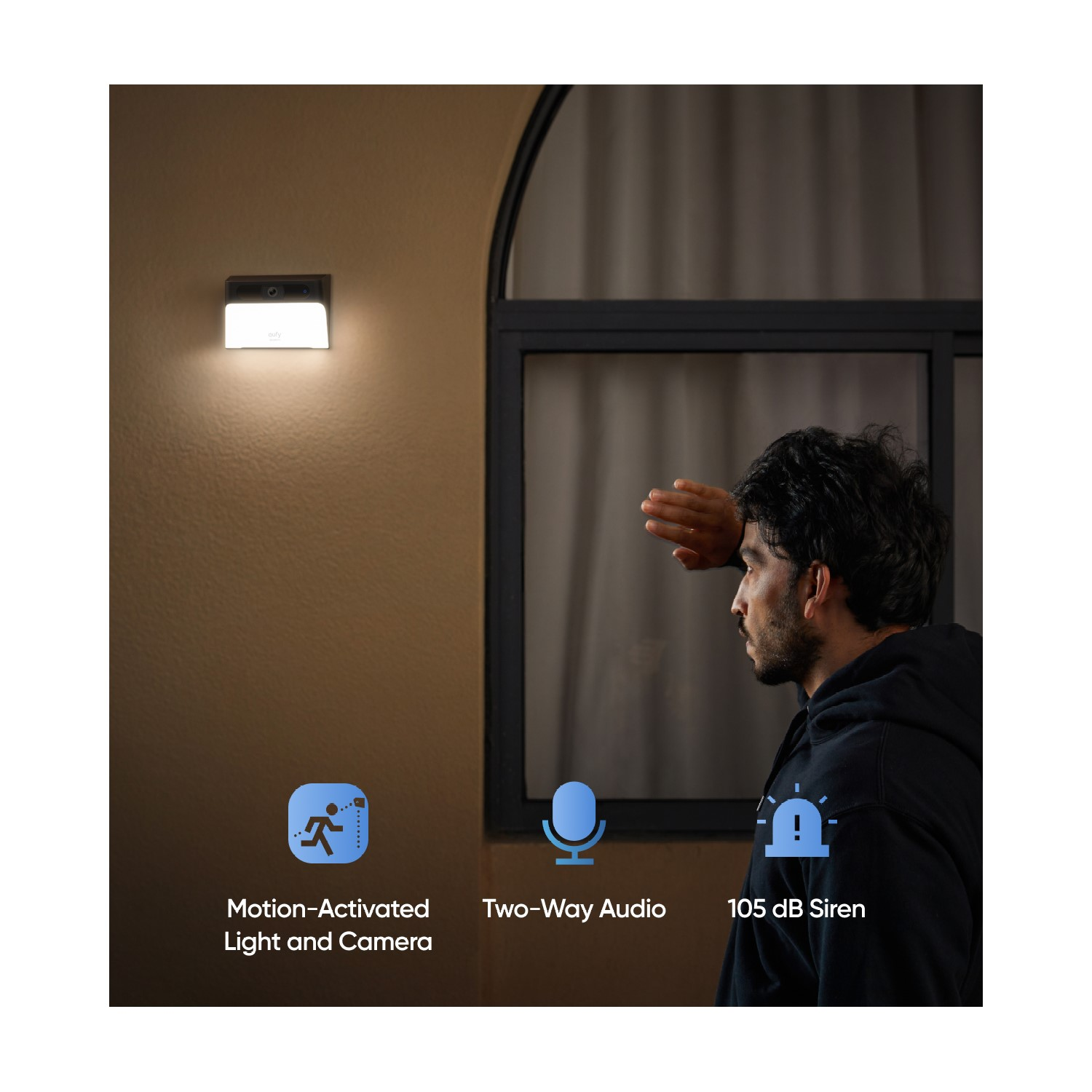 Een man kijkt naar een muur met een licht en camera. Tekst legt functies uit zoals audio en sirene.