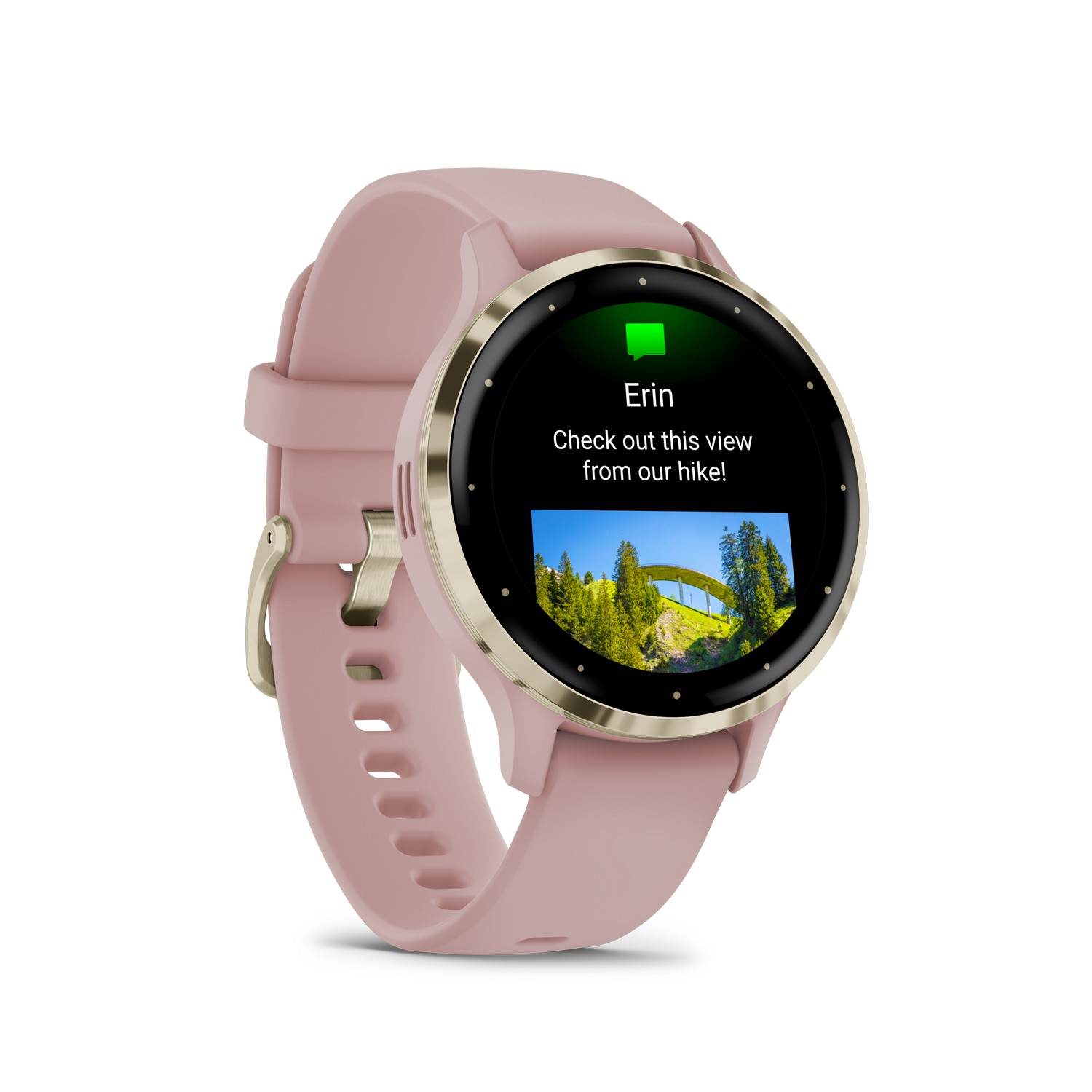 Smartwatch met een bericht en een uitzicht op een landschap.
