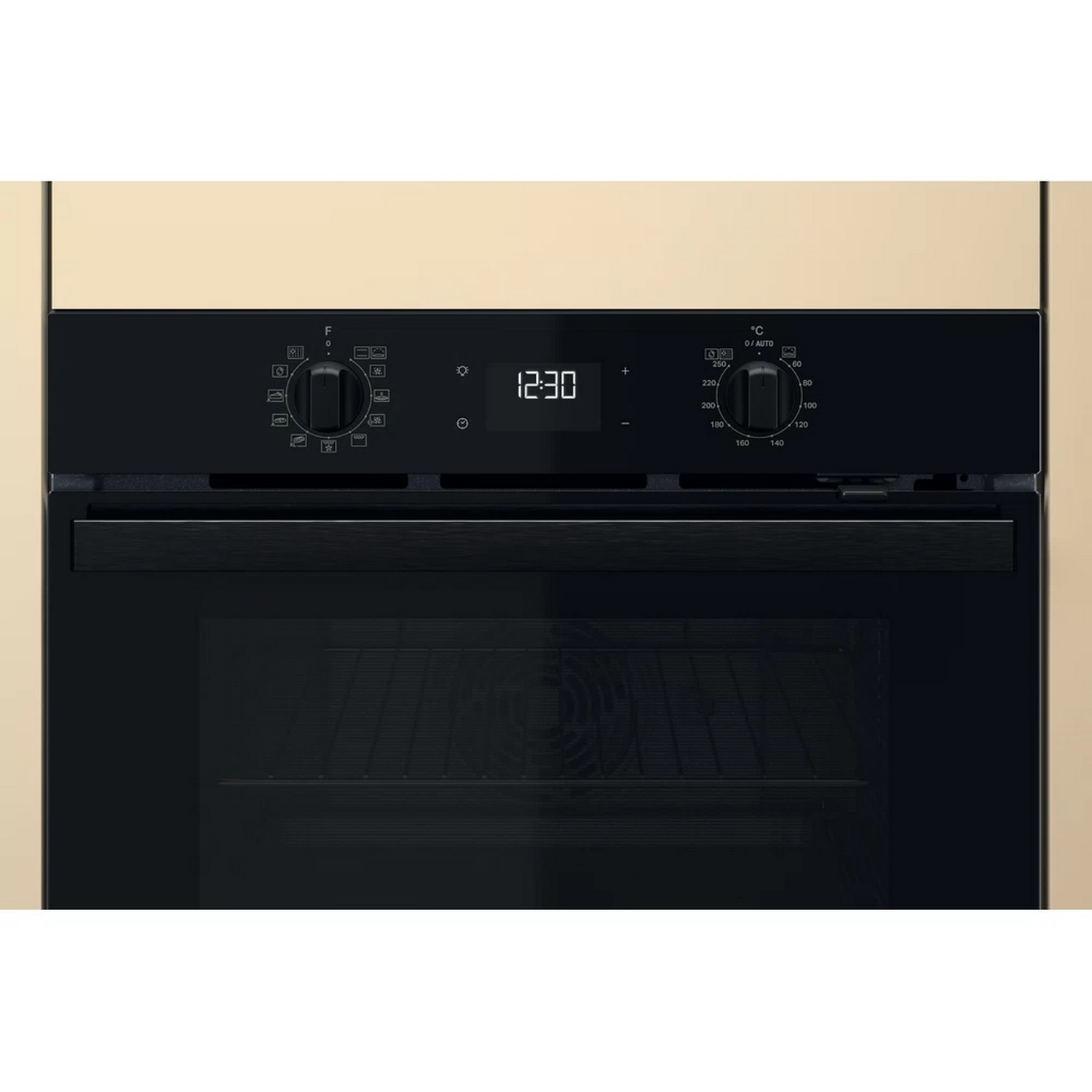 Oven control panel with display showing 12:30, dials, and buttons.