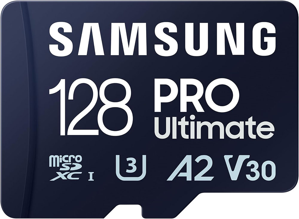 Samsung 128 PRO Ultimate microSD card. Features 'microSDXC I' and 'U3 A2 V30' labels. Dark blue background.