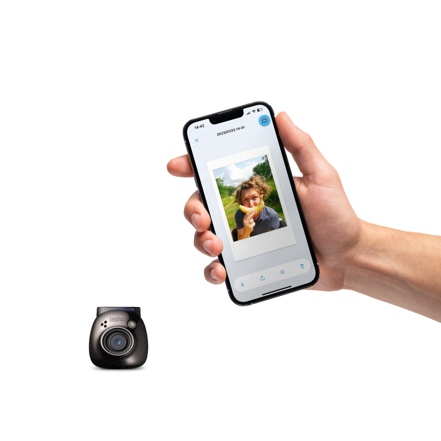 Hand holding a phone displaying a photo, with an Instax camera below.