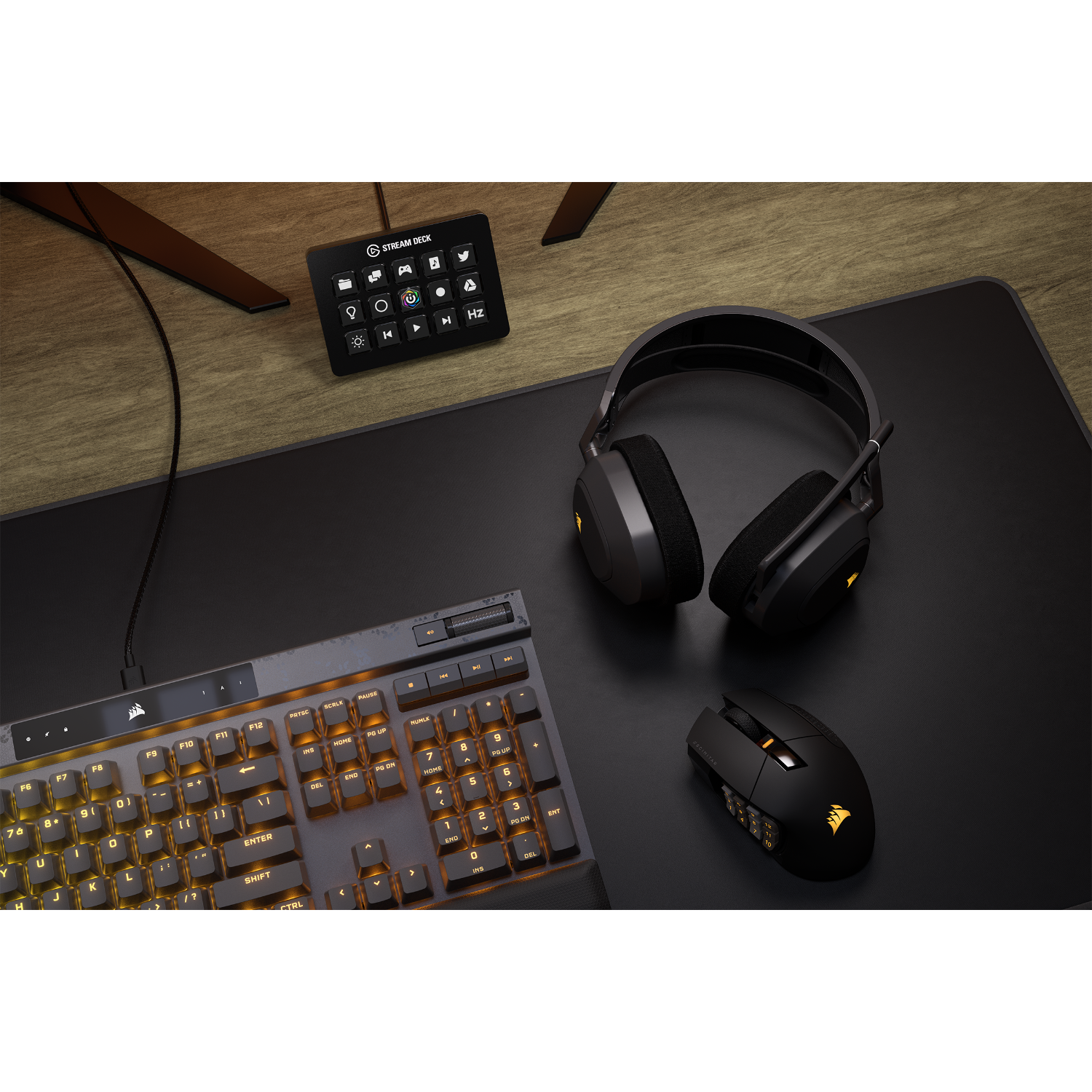 A desk setup with a keyboard, mouse, headset, and a Stream Deck, all in black.