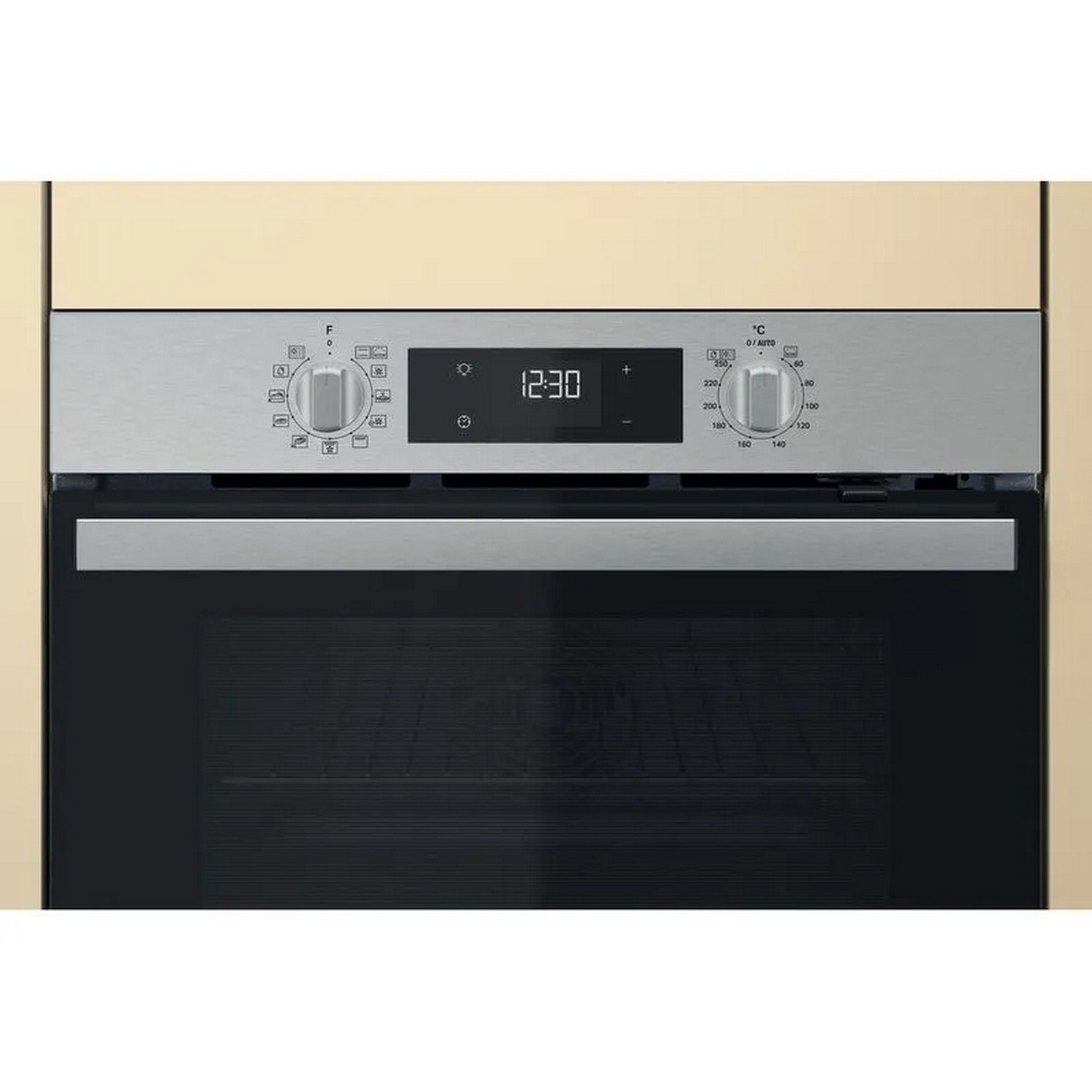 Oven control panel. Knobs and a digital display are visible.