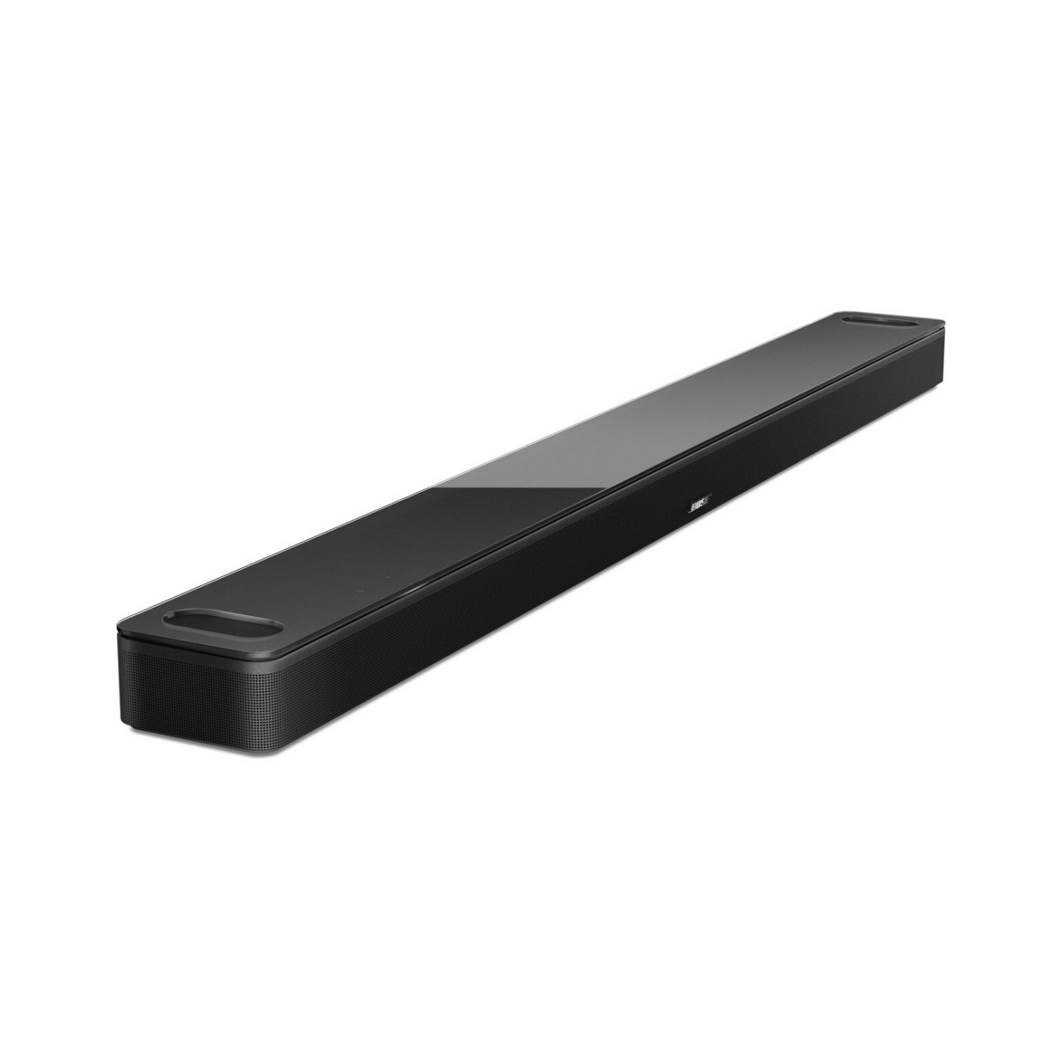 Une barre de son noire est positionnée en diagonale sur un fond blanc. La surface supérieure est brillante.