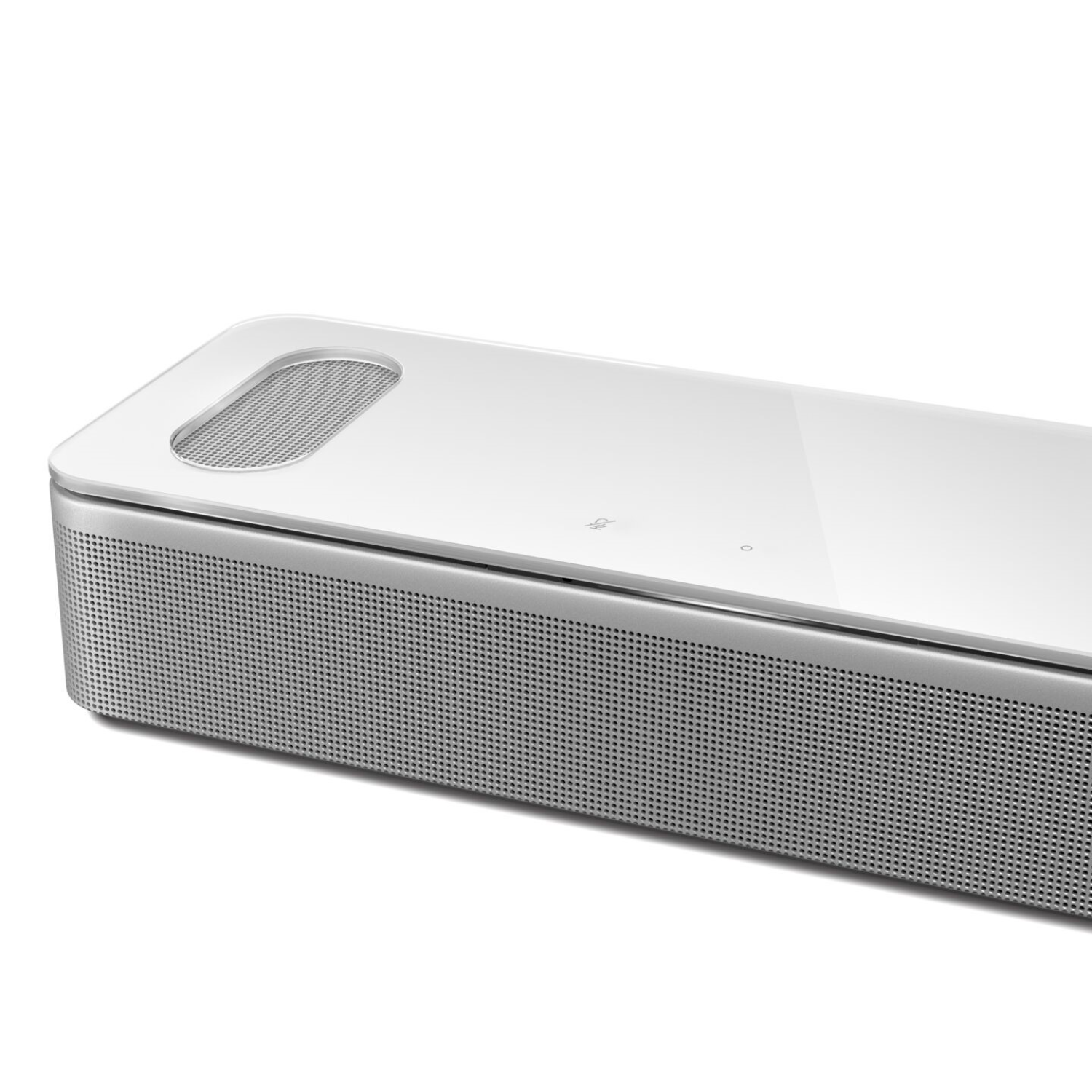 Close-up of a white soundbar with a silver frame, showing a speaker grill.