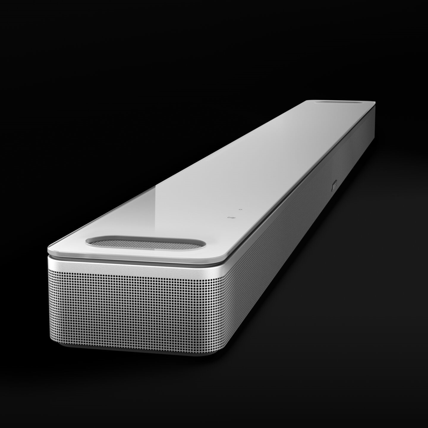 A silver soundbar on a black background, with a modern, sleek design.