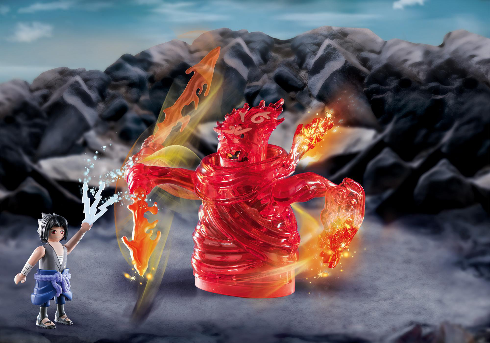 Playmobil-Figur eines roten Feuerwesens, das gegen einen Ninja kämpft. Hintergrund ist eine felsige Landschaft.
