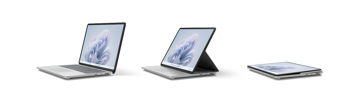 Drei silberne Laptops in verschiedenen offenen Positionen, die Bildschirme mit blauem Design zeigen.