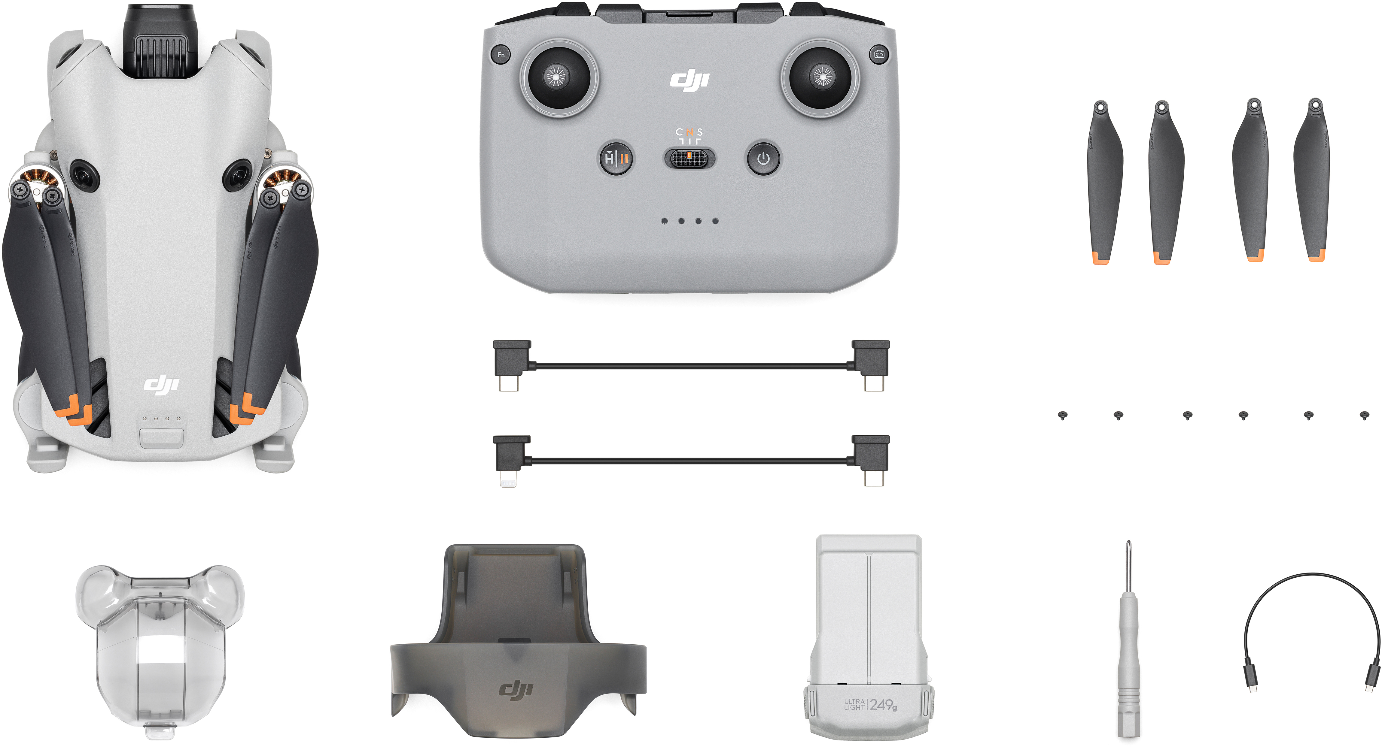 Un drone et ses accessoires sont affichés. Il comprend une manette, des hélices et une batterie.