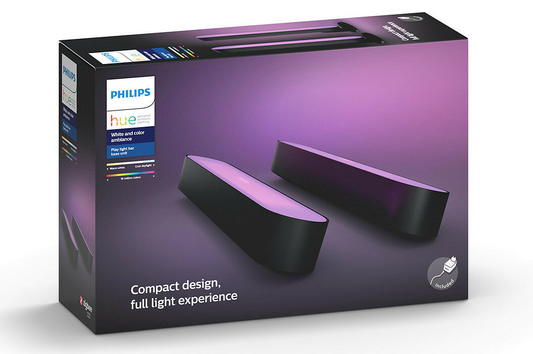 Pudełko inteligentnych świateł Philips Hue, z dwoma światłami świecącymi na różowo.