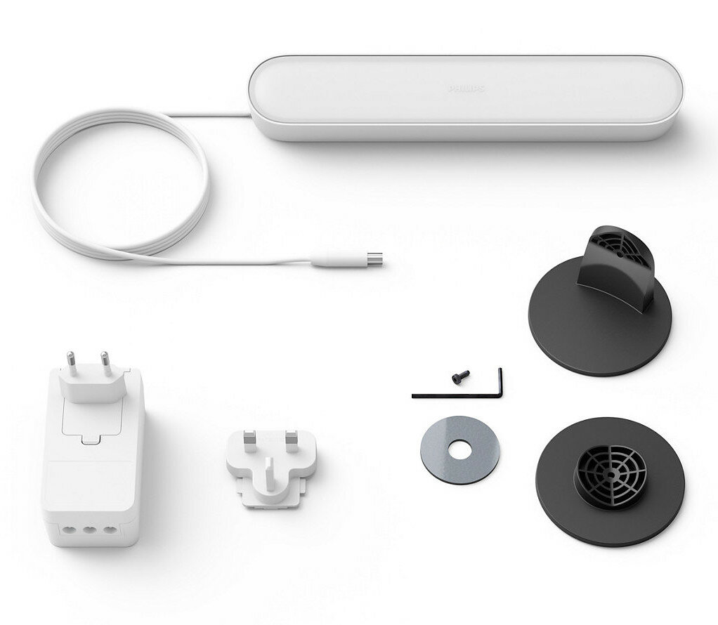 Elementy systemu oświetleniowego Philips Hue: zasilacz, wtyczki i elementy montażowe.
