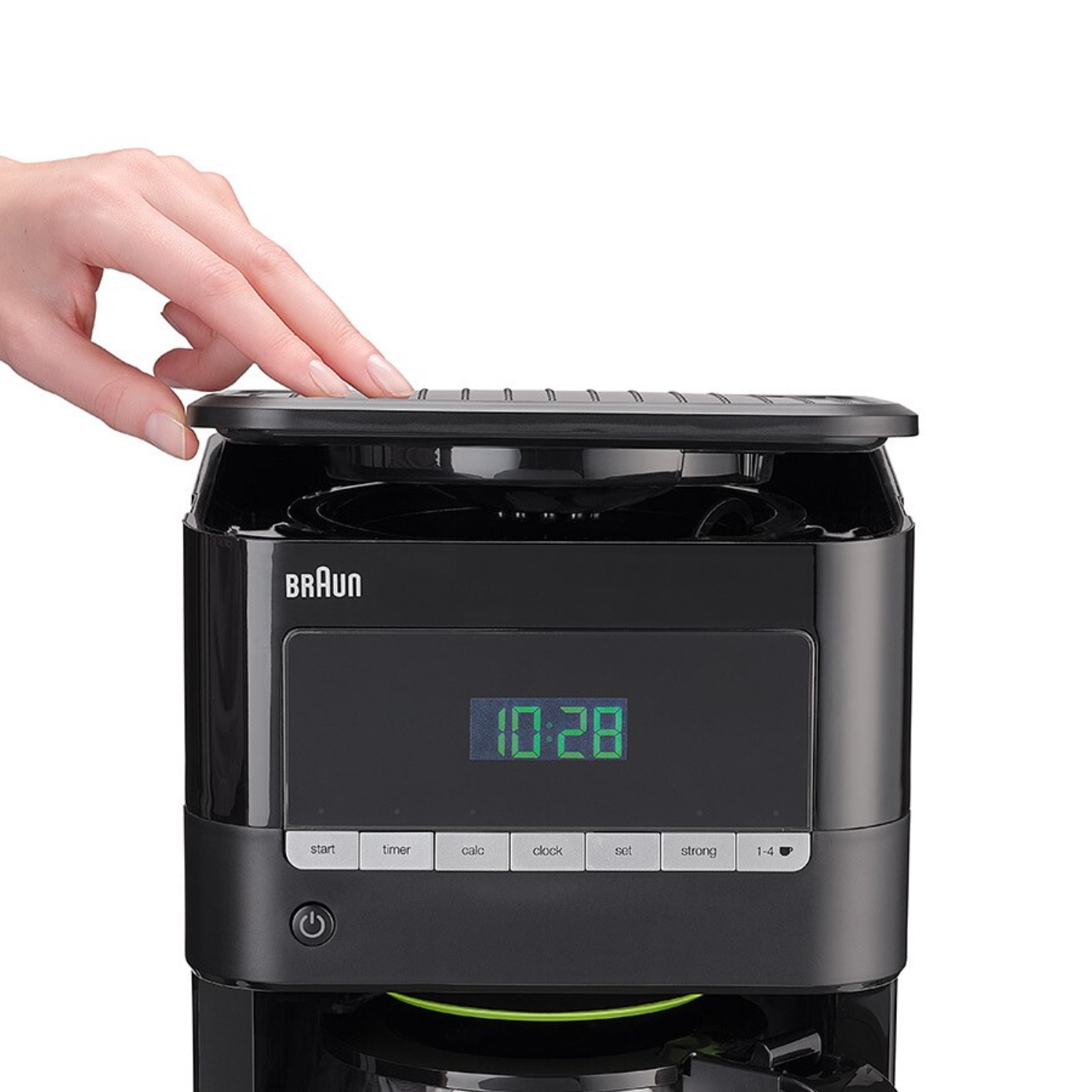 A black coffee maker with a hand on top, a display shows 10:28.