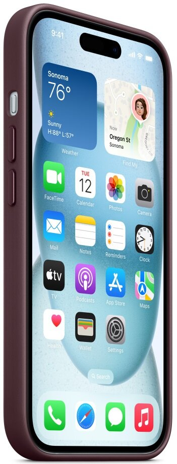 iPhone na stole, pokazujący ekran główny z ikonami aplikacji. Telefon w bordowym etui.