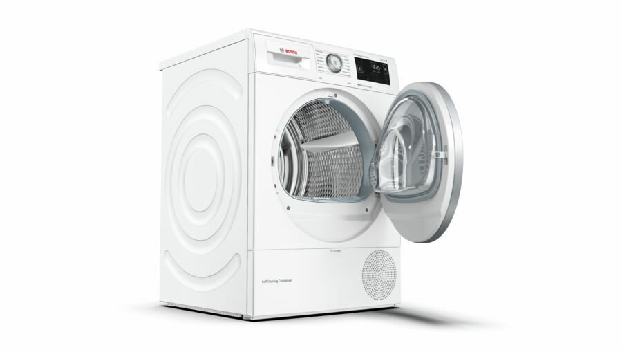 Biała, otwarta pralka ze stalowym bębnem.