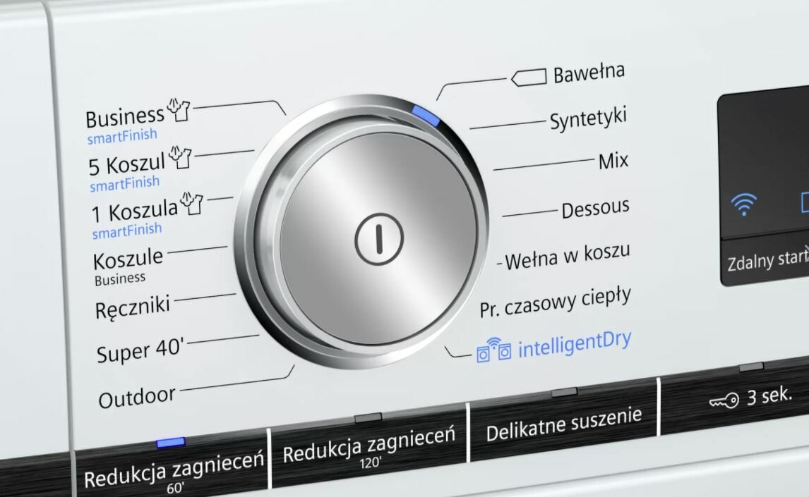 Zbliżenie panelu sterowania pralki.