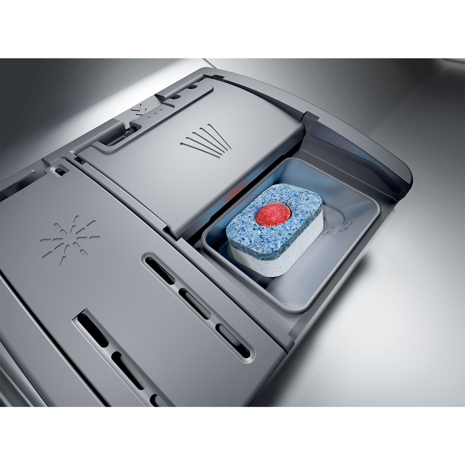 Compressa di detersivo per lavastoviglie nel suo dispenser.