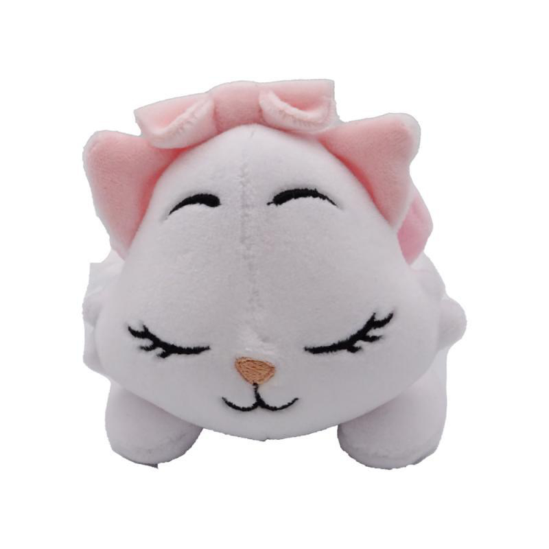 Weißes Katzen-Stofftier mit rosa Schleife.