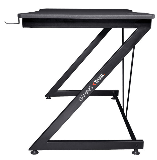 Czarny stół gamingowy z ramą w kształcie litery Z i logo Trust na białym tle.