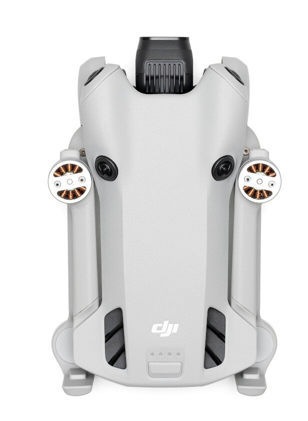 Szary dron z logo DJI, widok z góry.