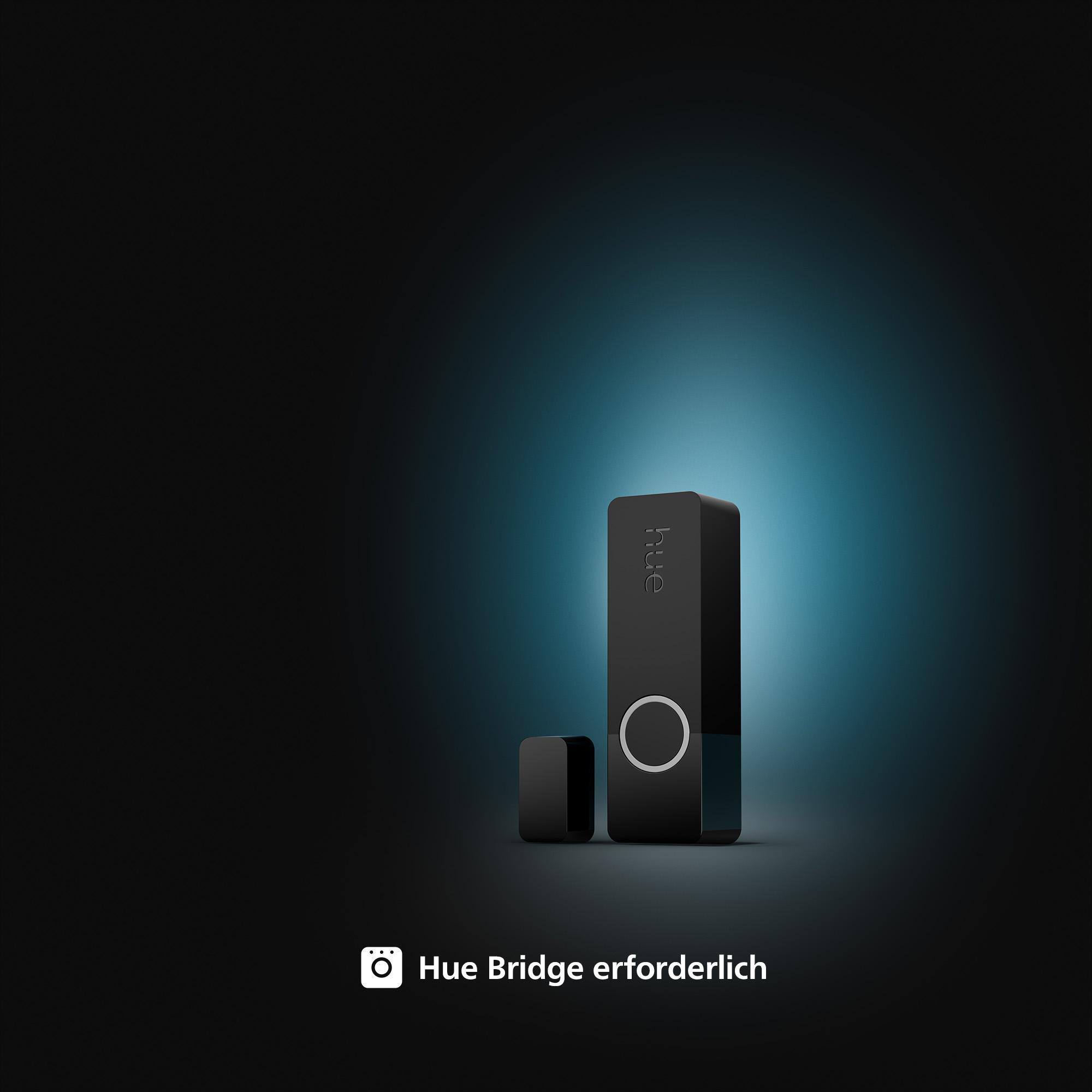 Schwarzer Smart-Home-Hub und kleines quadratisches Gerät auf blauem Hintergrund.