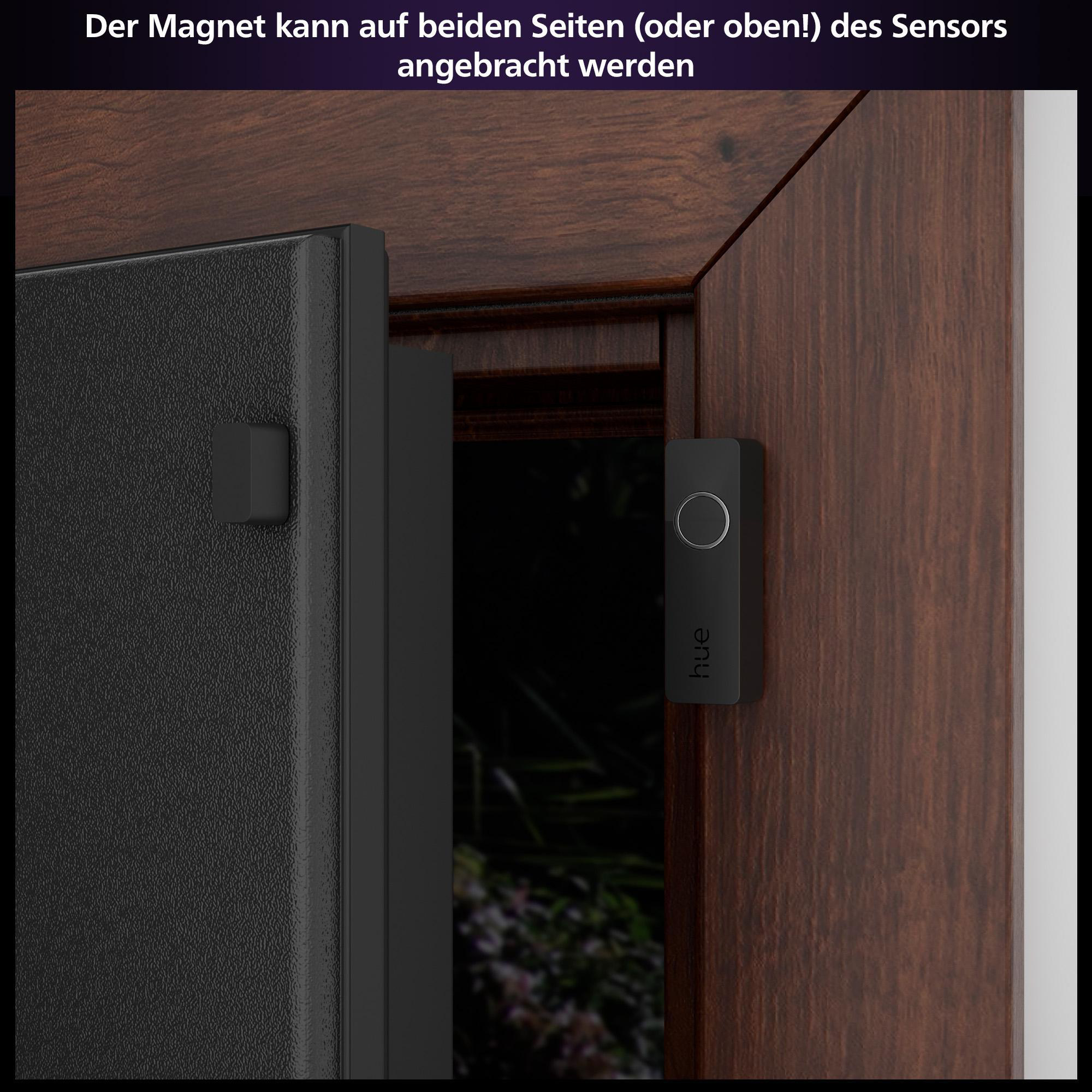Türsensor und Magnet, schwarz und weiß, an einem braunen Türrahmen montiert.