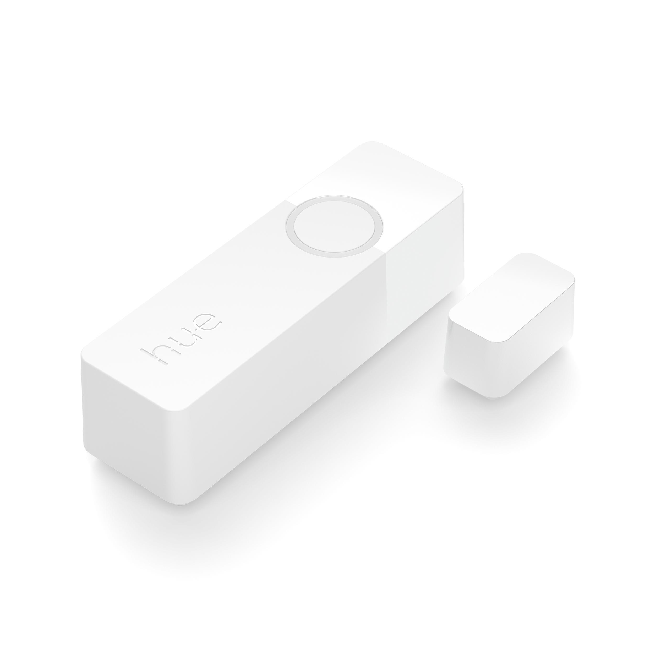 Zwei weiße Smart-Home-Geräte, ein Sensor und ein Magnet, auf einer weißen Oberfläche.