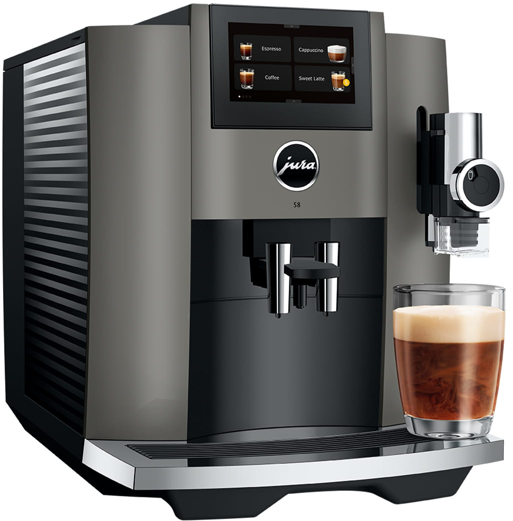 Una macchina da caffè Jura con un bicchiere di caffè.