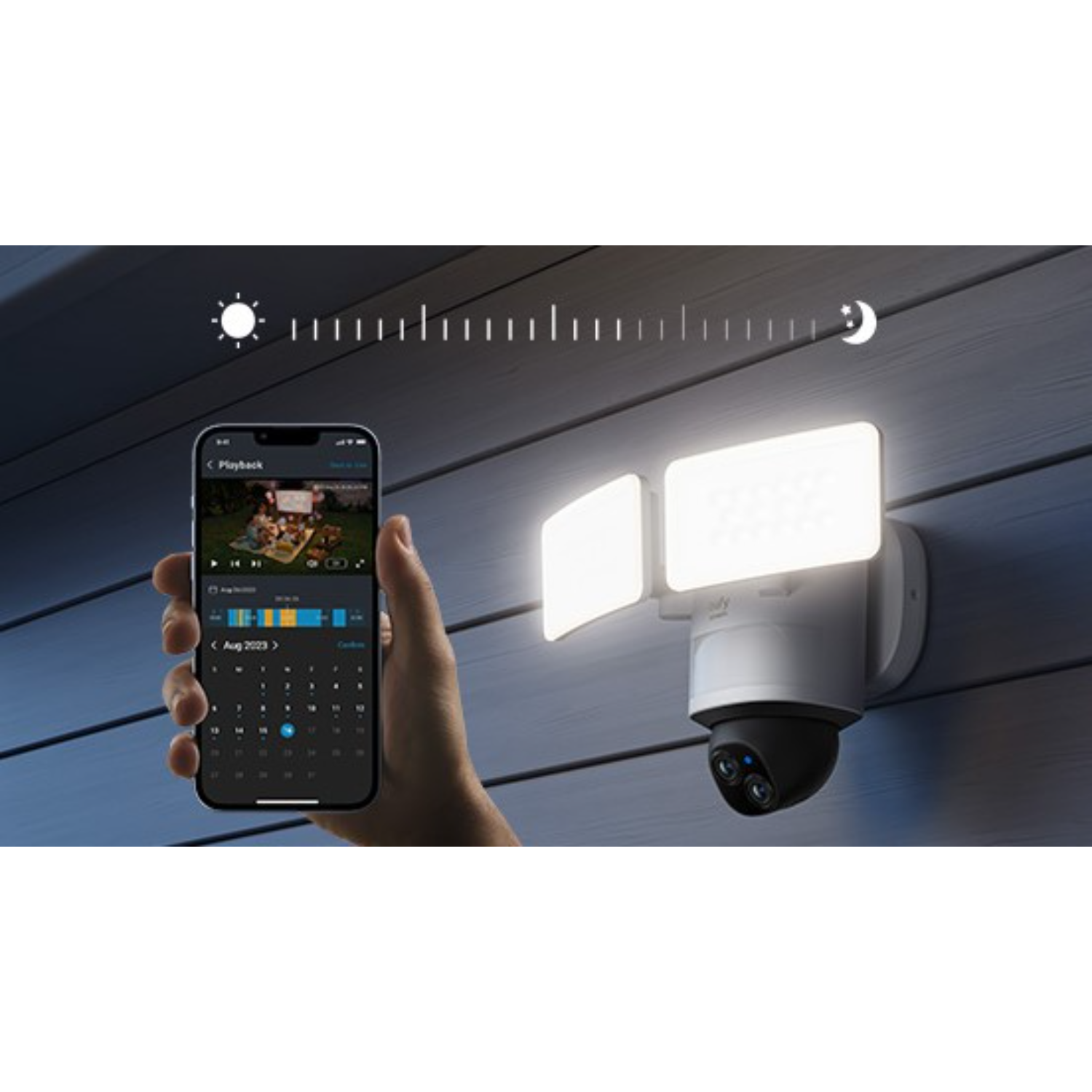 Security camera on a wall, phone displaying camera footage.
