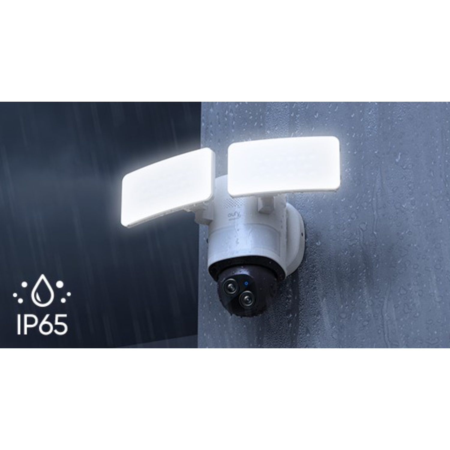 A white security camera with two lights, mounted on a wall, with a rainy background.