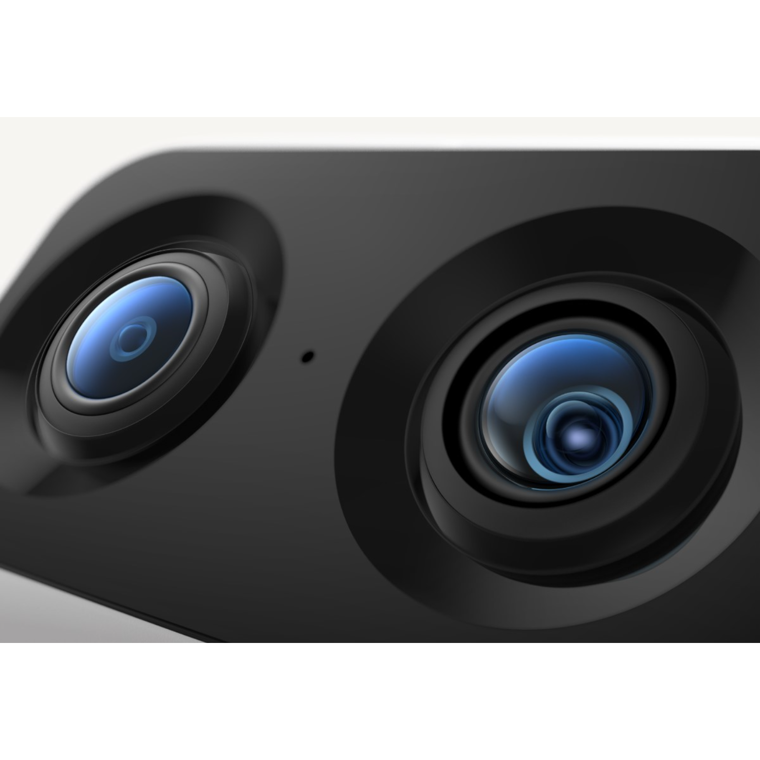 Close-up of a black device with two lenses, reflecting blue light.