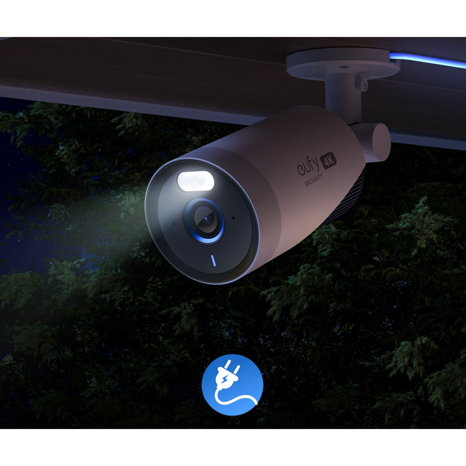 A white outdoor security camera mounted under an eave, with a blue light and a power plug icon.