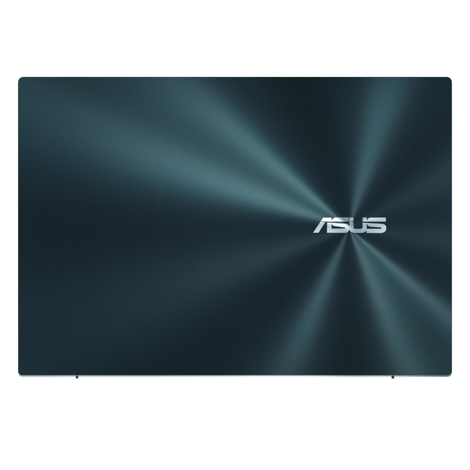 Tapa de portátil azul oscuro con logotipo ASUS plateado. La superficie tiene un patrón radial.