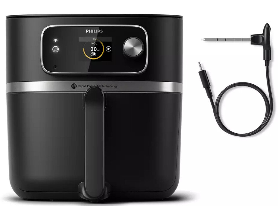 Czarna frytkownica powietrzna z wyświetlaczem cyfrowym i sondą do żywności na białej powierzchni.