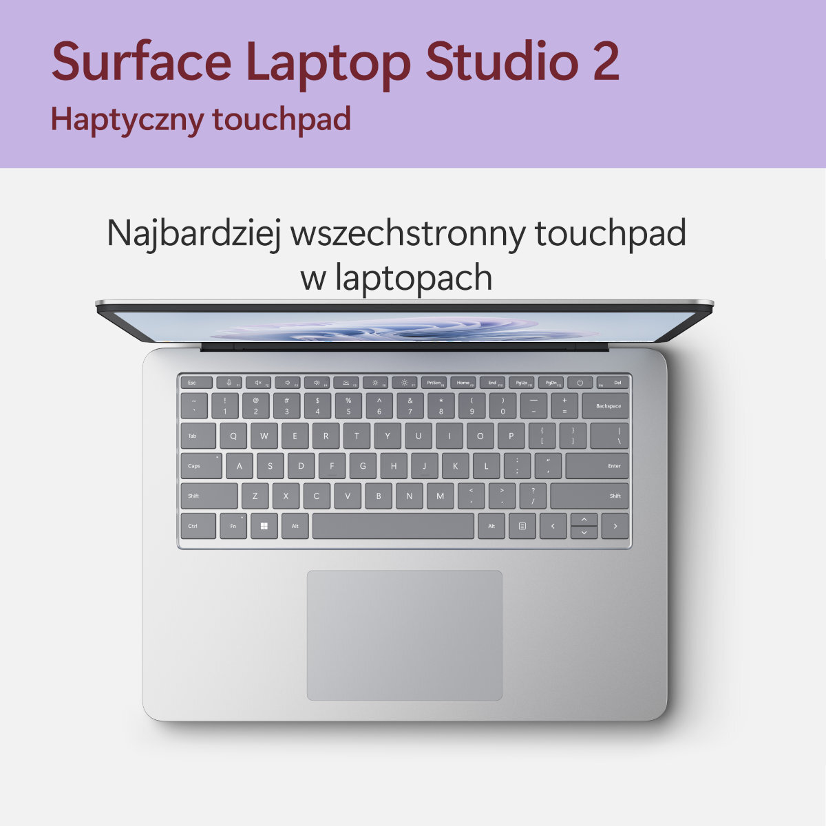 Surface Laptop Studio 2: Klawiatura z otwartym ekranem, tekst u góry i na dole.