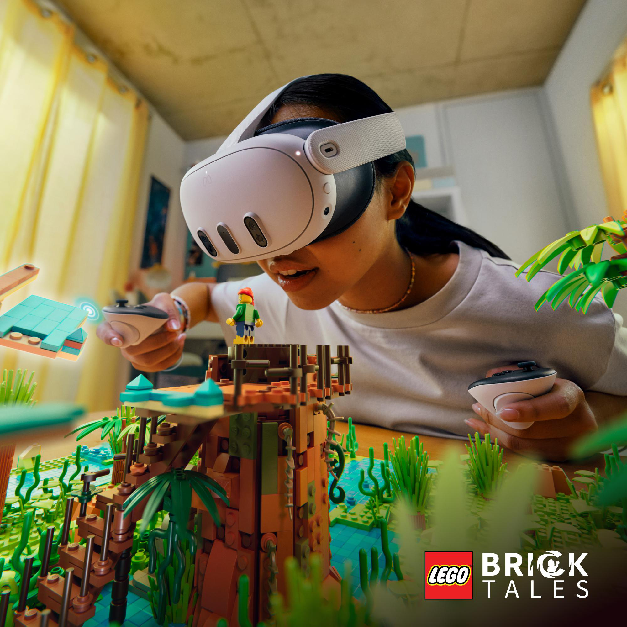 Person mit VR-Brille interagiert mit LEGO-Modell mit zwei Controllern.