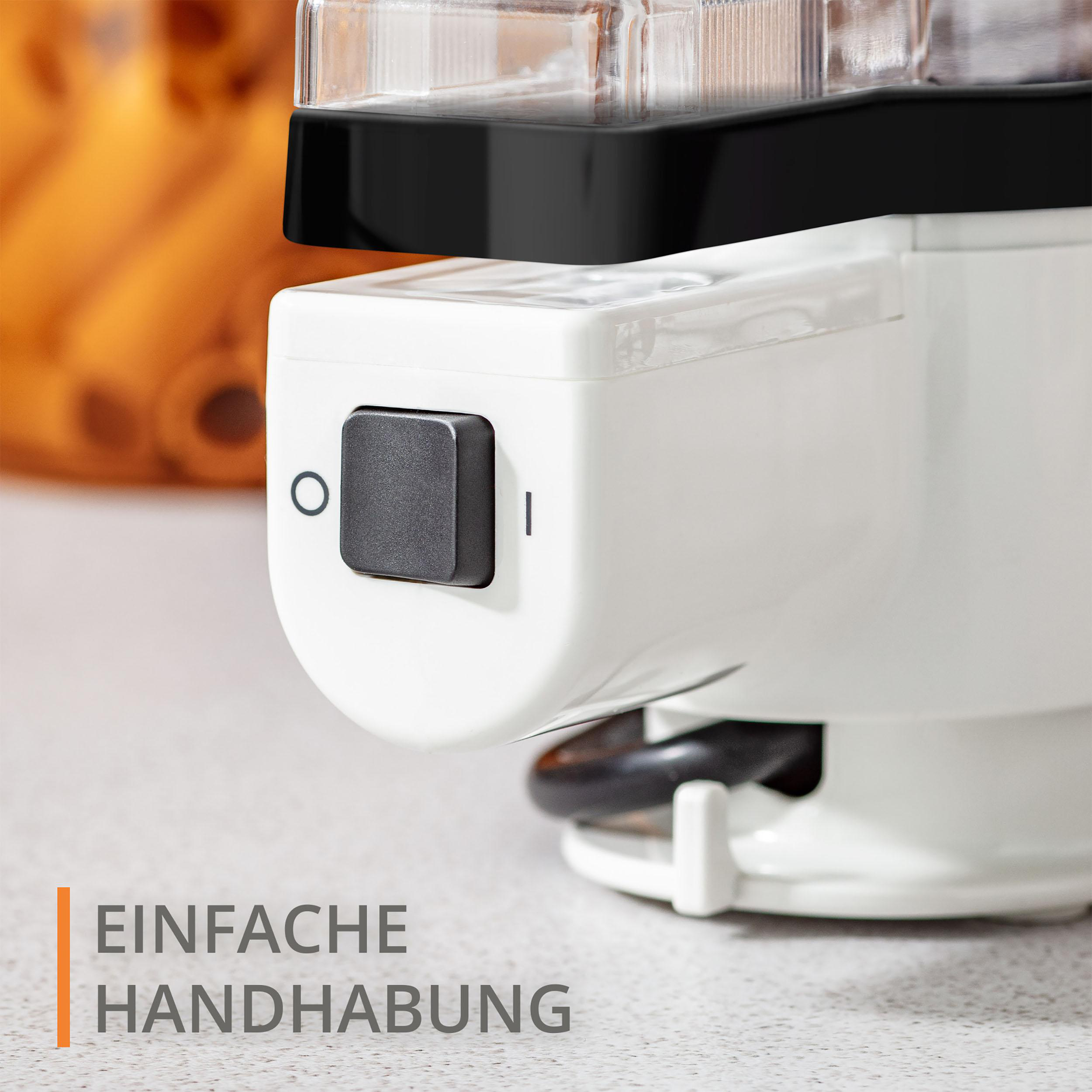 Nahaufnahme eines weißen Kaffeeautomaten. Es gibt einen schwarzen Knopf für die Stromversorgung. Der Text 'EINFACHE HANDHABUNG' ist sichtbar.