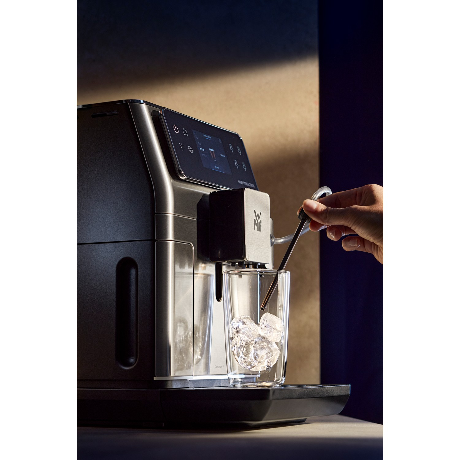 Black and silver air fryer on a wooden table, with a timer display showing 200C and 140C.