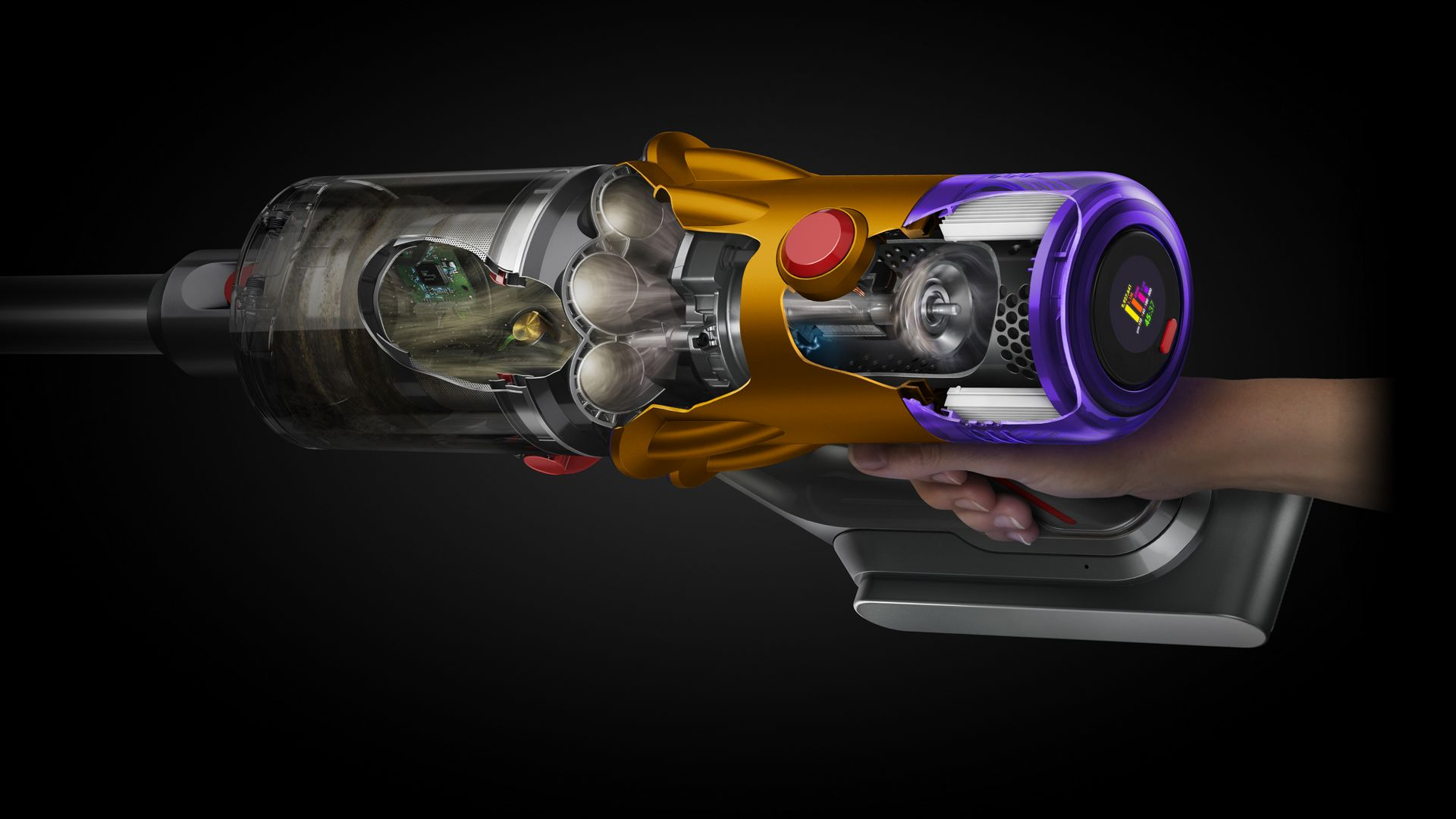 Bir kişinin elinde tuttuğu bir Dyson elektrik süpürgesinin kesit görünümü.