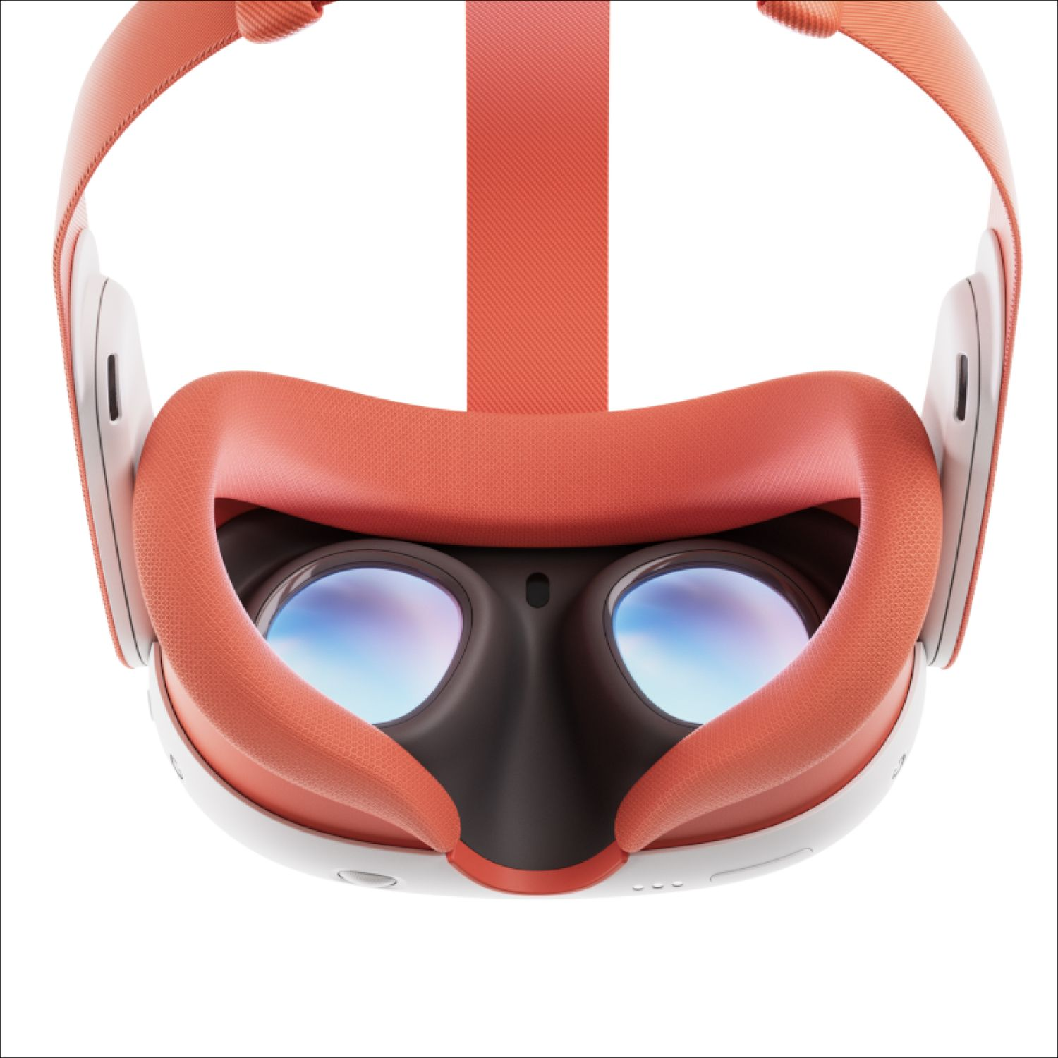 Close-up of a VR headset. It has orange straps and padding, black eye area, and white frame. Lenses reflect light.