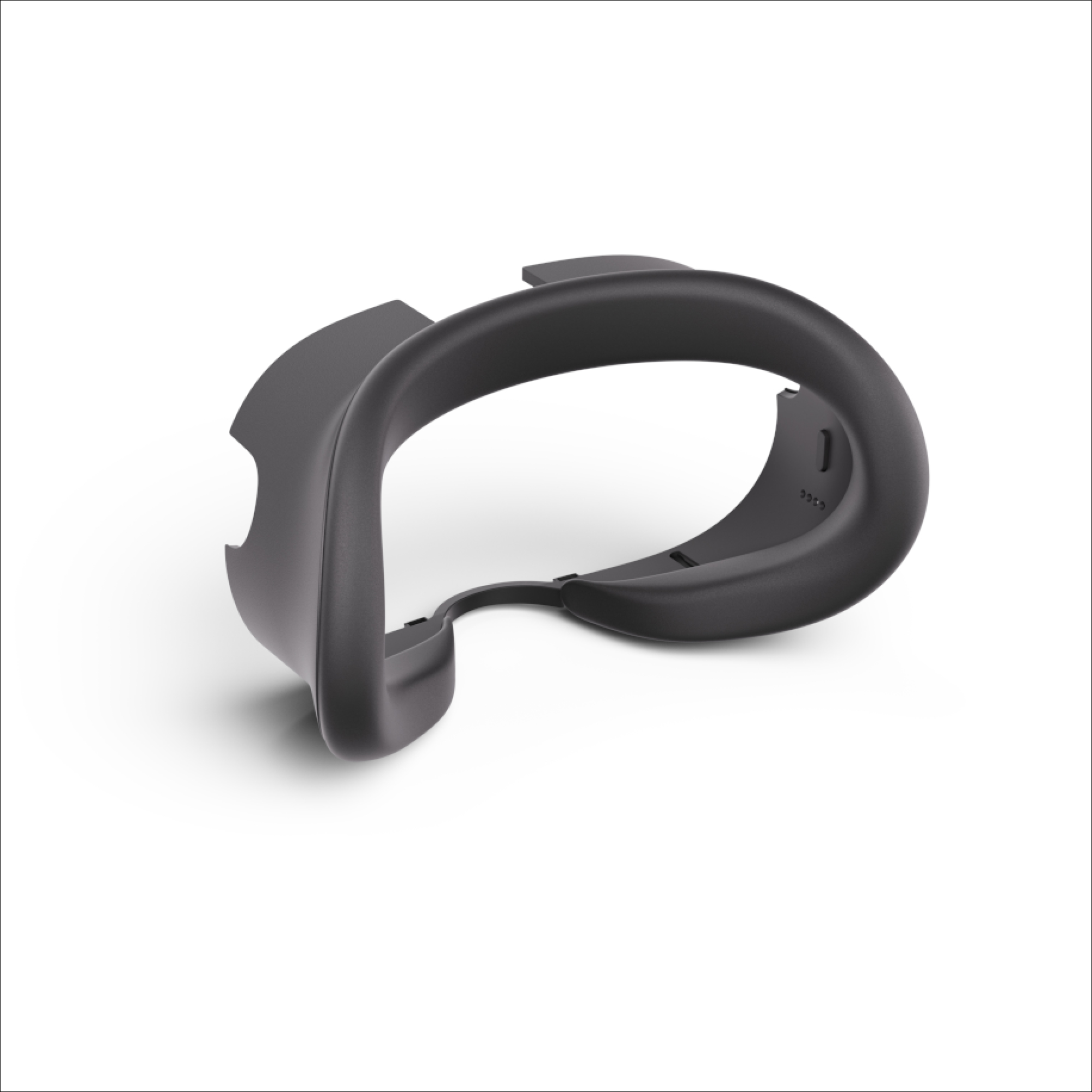 Se muestra una cubierta facial para auriculares de realidad virtual. Es negra y tiene forma de curva.