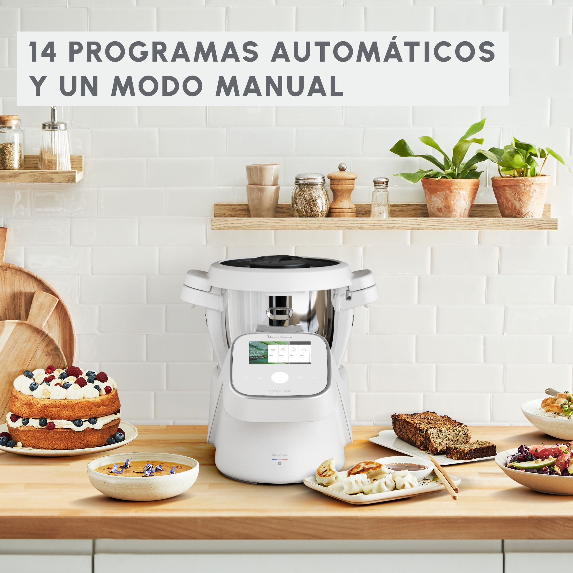 Escena de encimera de cocina con electrodomésticos y comida. Texto: 14 programas automáticos y modo manual.