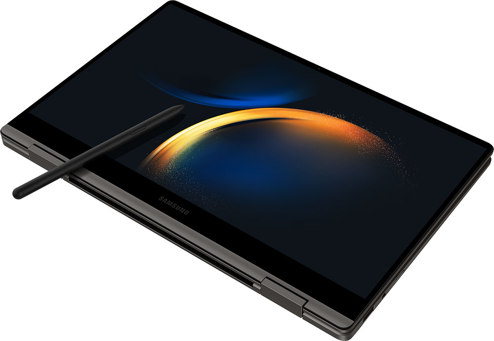 Een donkergrijze Samsung Galaxy Book wordt open getoond, met een pen. Het scherm toont een kleurrijk, abstract ontwerp.