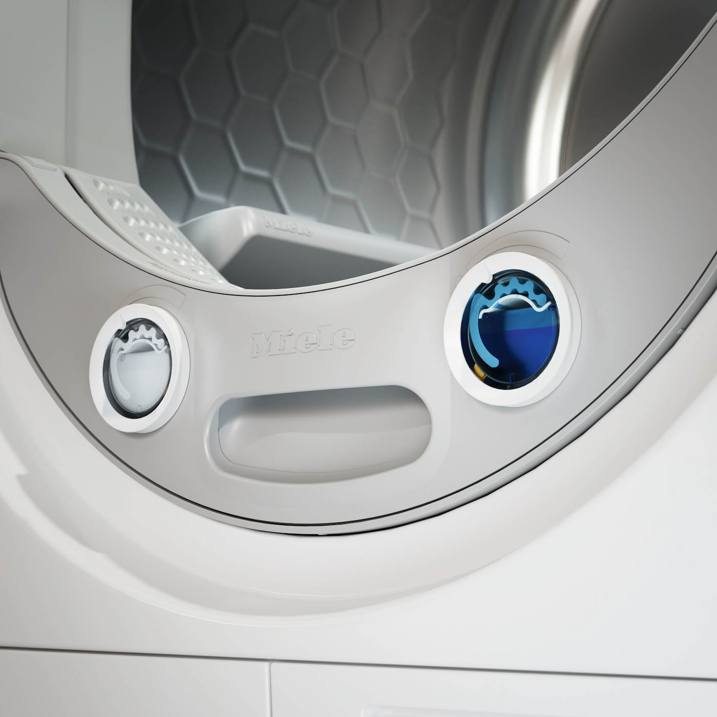 Nahaufnahme einer Miele Waschmaschine mit Bedienelementen und Trommel.