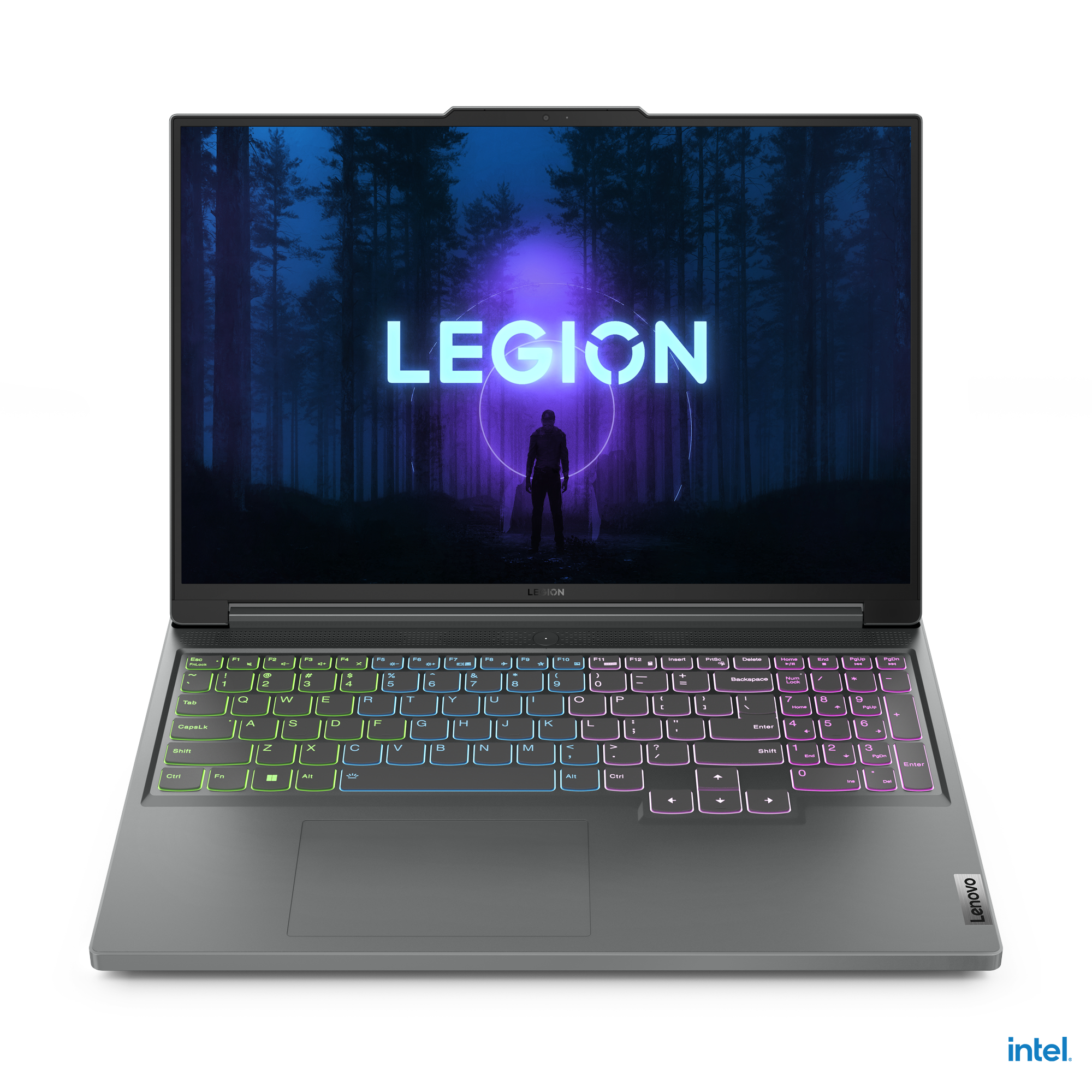 Siyah bir yüzeyde Lenovo Legion dizüstü bilgisayar. Ekran, mavi ışıklı bir ormanda bir kişiyi gösteriyor.