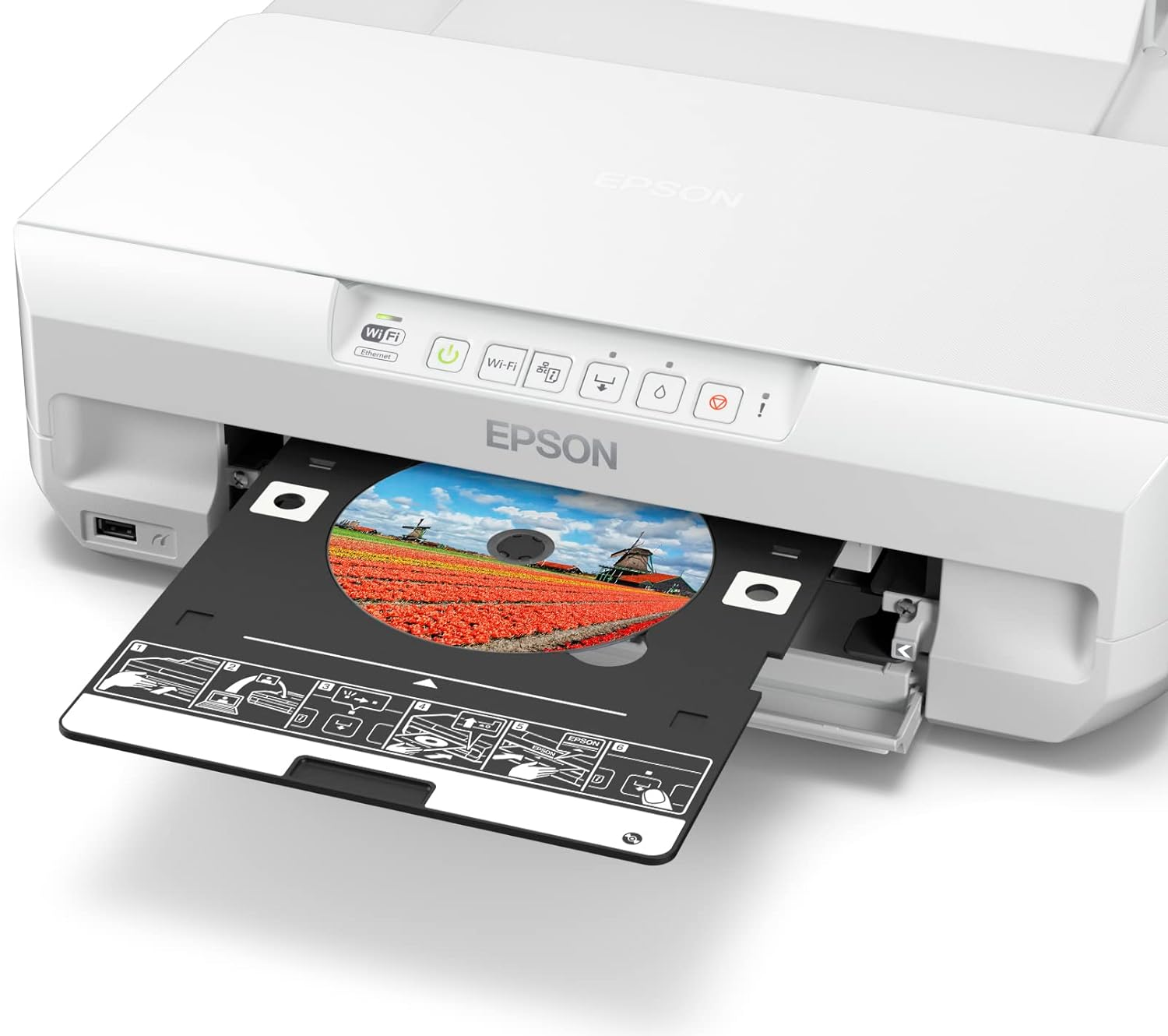 Impresora Epson blanca con bandeja de CD/DVD abierta, mostrando imagen colorida.