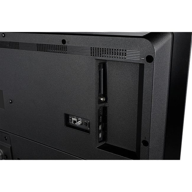La parte trasera de un televisor negro con puertos de conexión y una entrada de cable.