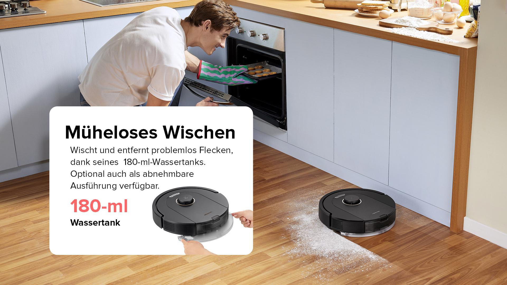 Ein Mann legt Kekse in einen Ofen. Zwei Roboter reinigen den Holzboden.