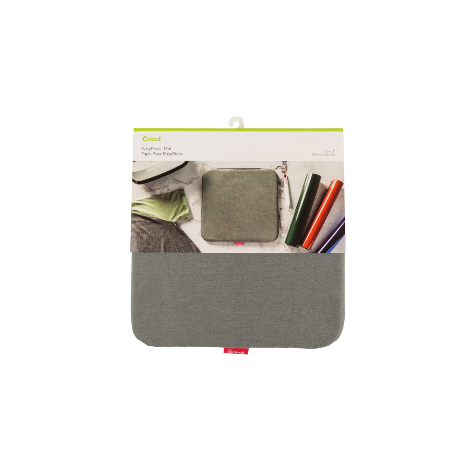 Cricut EasyPress mat with a package and some rolls of heat transfer vinyl.