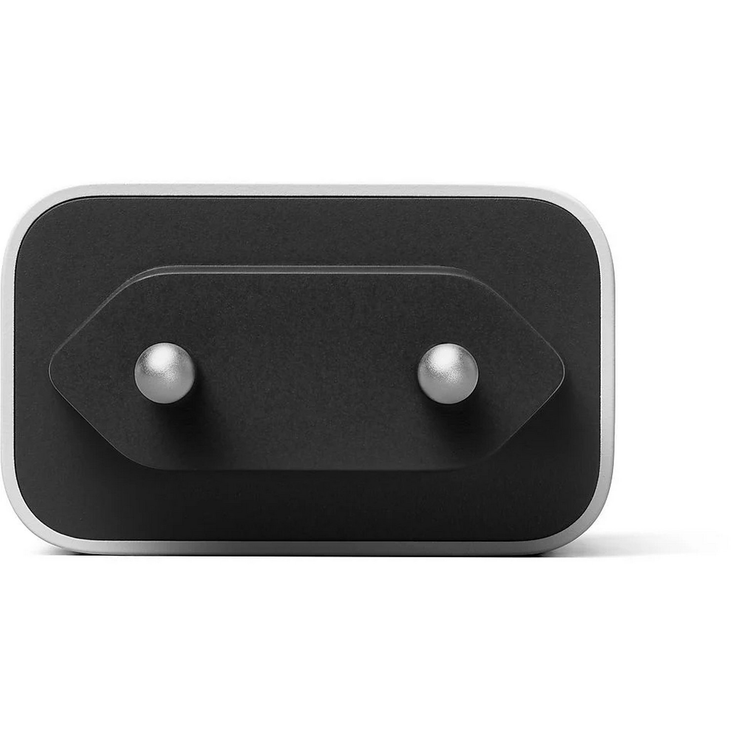 Black and silver power adapter with two silver pins, close-up.